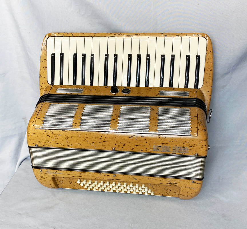 Small vintage black and white accordion